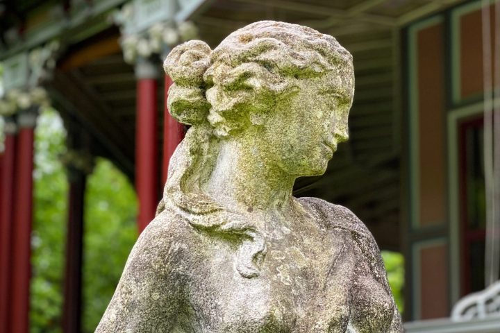 a statue in front of a building