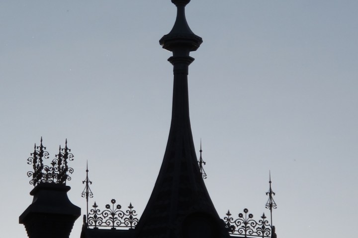 a large tall tower with a clock at the top of a building