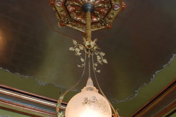 a clock hanging from the ceiling